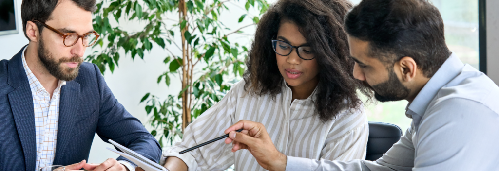 Three people discussing business